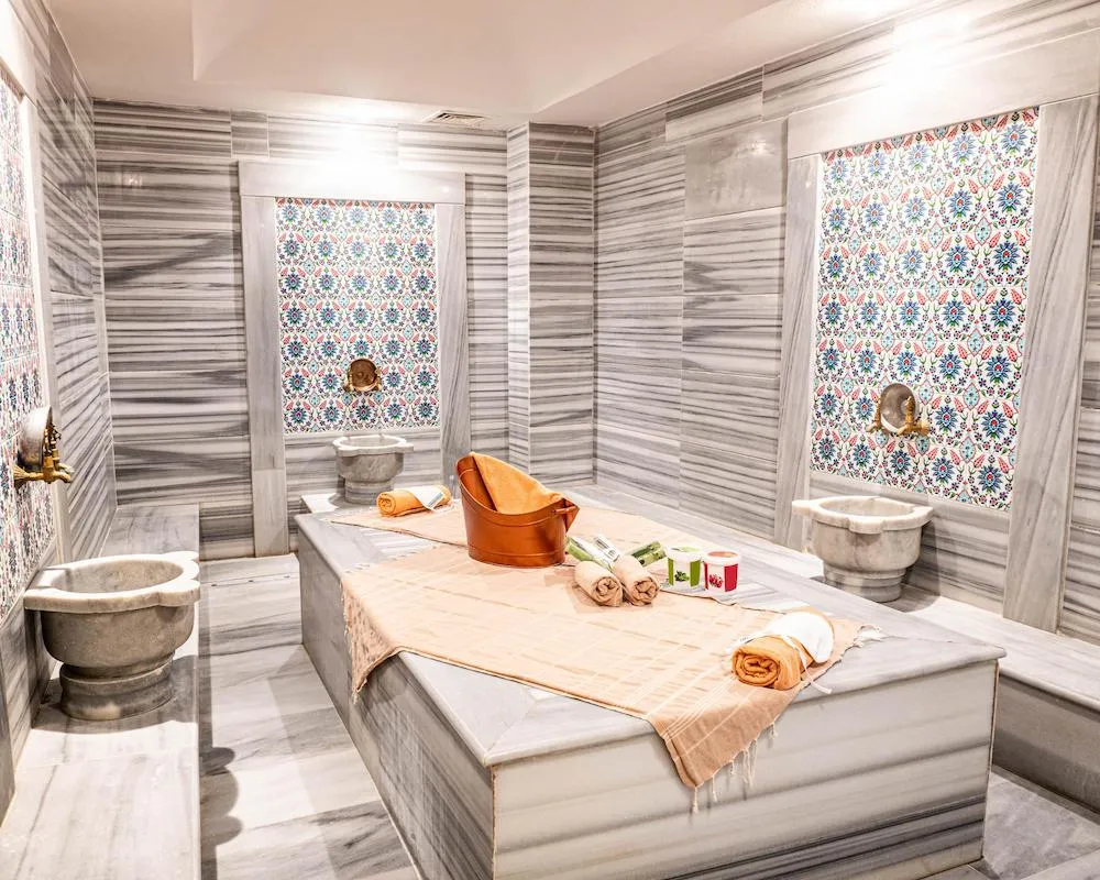Traditional Turkish spa with marble interior and wellness treatment setup in Fethiye, Turkey.